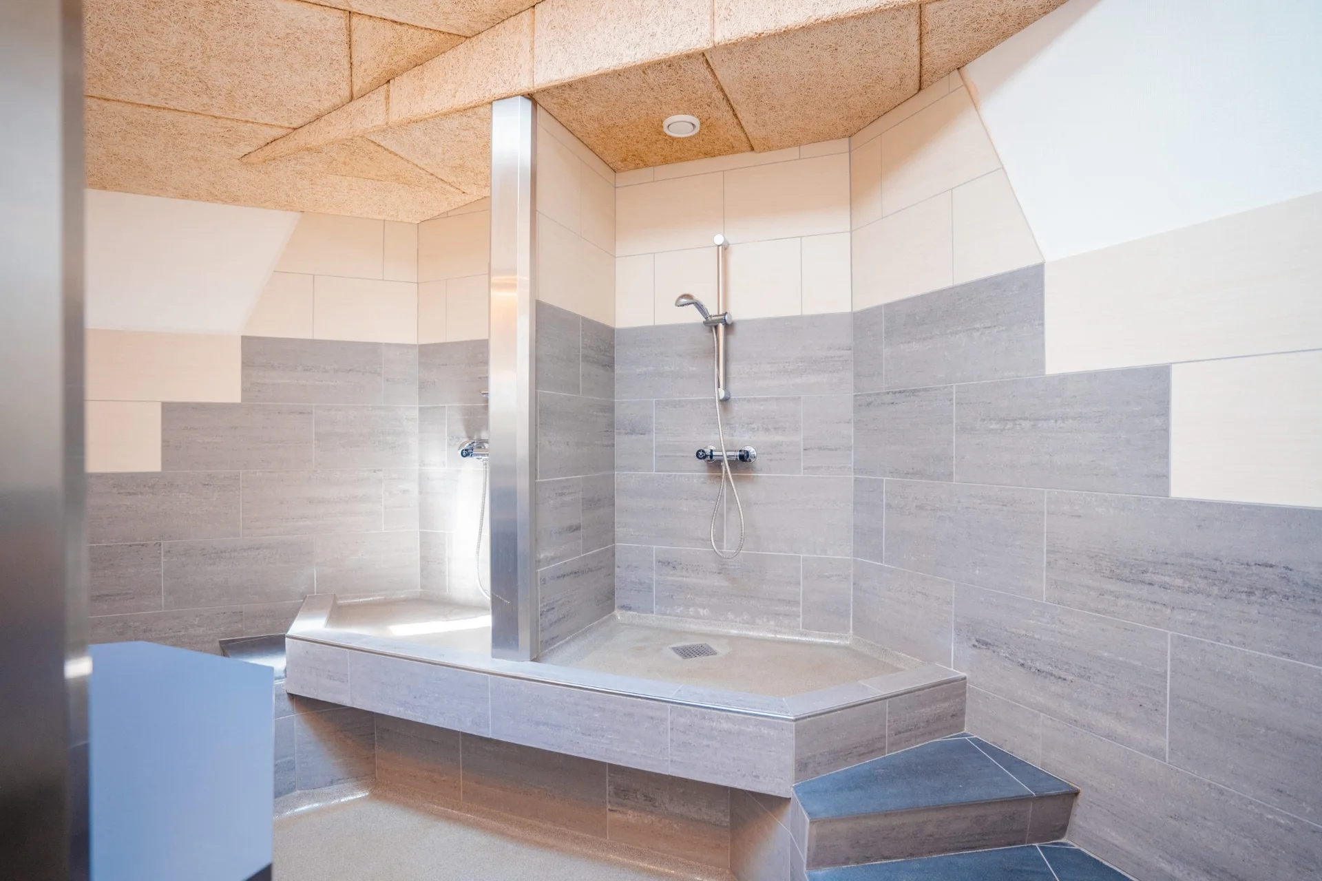 Roomy family bathroom with a shower cubicle and tiles