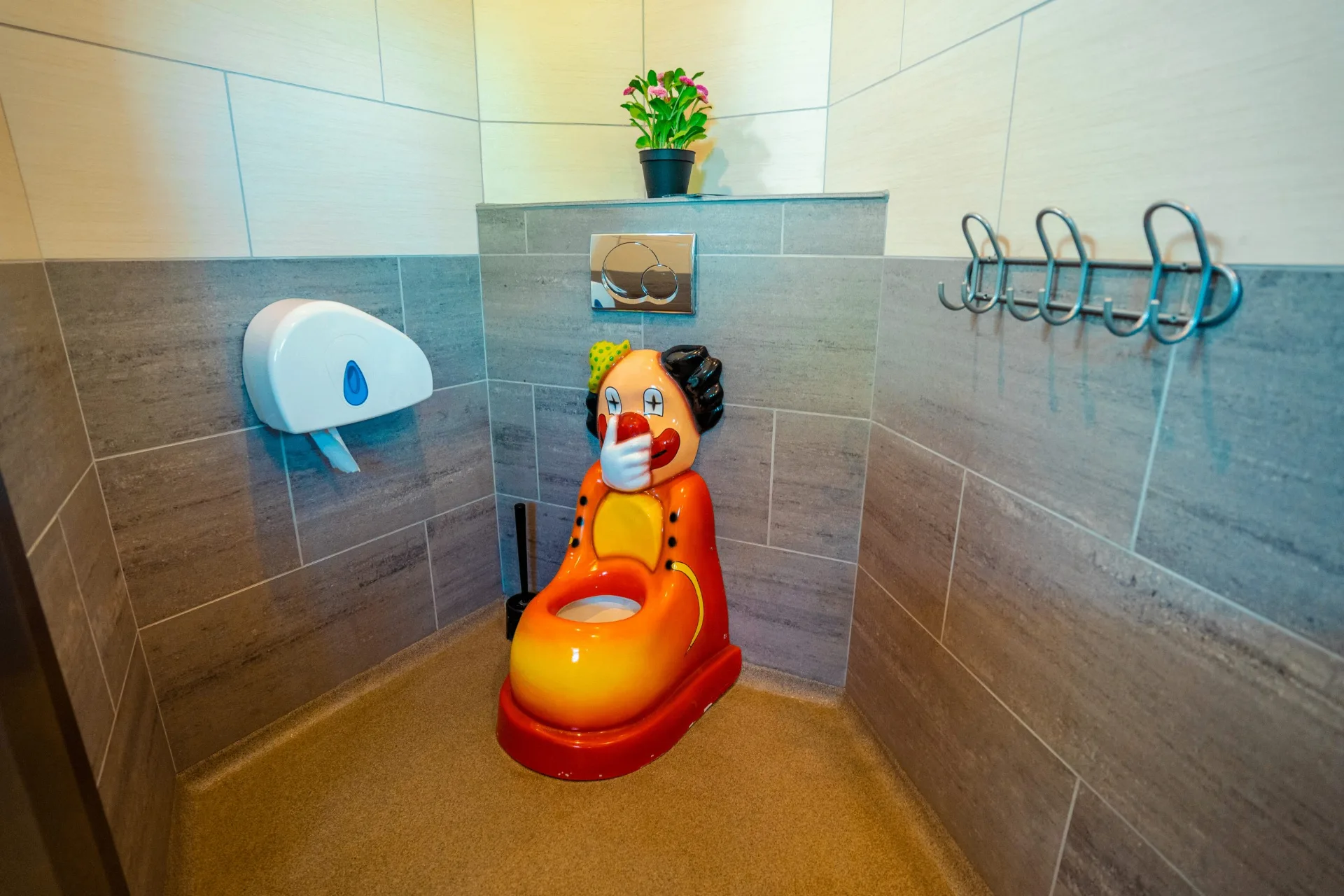 Children's toilet with a playful clown design